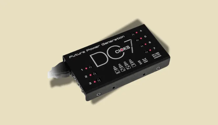 Close-up of the Cioks DC7 isolated power supply, showing multiple individually isolated outputs for powering guitar pedals cleanly and quietly.