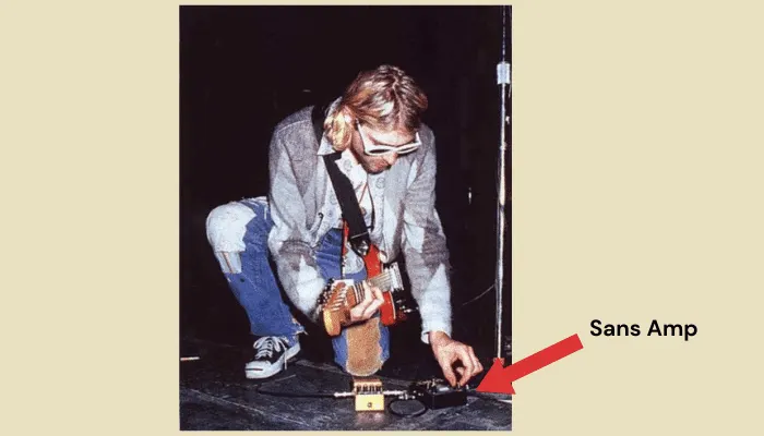 Kurt Cobain adjusting his Tech 21 SansAmp on stage during the In Utero tour