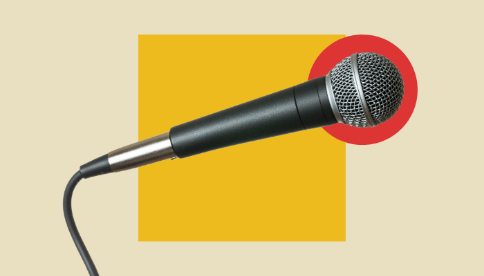 Dynamic vocal microphone on a colorful background, representing creative vocal effects using guitar pedals